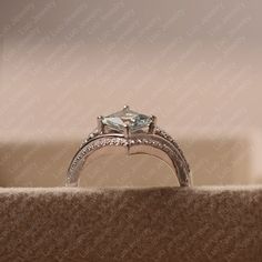 an engagement ring with a princess cut diamond