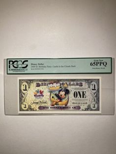 a mickey mouse $ 1 bill is on display