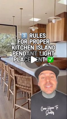 a man is standing in front of a kitchen island with chairs around it and the words rules for proper kitchen island pendant light placement