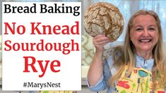 a woman holding a loaf of bread in front of her face with the words no knead sourdough rye