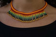 This original choker adorned with fringes has Swarovski crystals at its ends, you can wear it both in your daily life and at a special event. How it was done: It is handmade by an artisan from the Mexican Wixárica ethnic group, popularly known as Huichol. Craftsmanship from start to finish. This product contains a dose of Enthusiasm and Love that cannot be measured Materials: - Czech Crystal Beads "Preciosa Ornela". We use this type of high quality beads to achieve the special color of these pie Traditional Multicolor Festival Choker, Festival Multicolor Polished Beads Choker, Multicolor Handwoven Beaded Choker Necklace, Multicolor Handwoven Festival Choker, Huichol Necklace, Czech Crystal, Jewelry Bags, Crystal Beads, Special Events