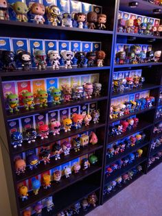 the shelves are filled with many different kinds of pop vinyls and action figure toys