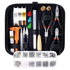 an assortment of crafting tools in a black case