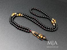 The handmade necklace is a feather or sun compass pendant and a tassel made of Tiger Eye and onyx stones. It incorporates 10, 4 mm natural Tiger Eye beads, 8.4 mm black onyx beads, and a copper accessory. The entire piece is completed with a nylon cord. (The necklace in the picture is 36-37 inches ) other designs www.etsy.com/shop/minejewelleryart The products are custom-made and done of their kind. They can be differentiated at the minimum level from the photographs (in coloring, patterns, brig Hand-strung Black Bohemian Beads, Black Hand-strung Bohemian Beads, Black Bohemian Hand-strung Beads, Black 8mm Beads Jewelry For Festival, Black Hand-strung Bohemian Necklace, Black Bohemian Hand-strung Necklaces, Black Hand-strung Amulet Necklace, Black Hand-strung Amulet Jewelry, Black Bohemian Necklace With 8mm Beads