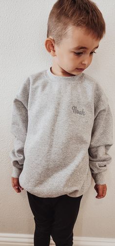 Sweatshirts are embroidered with high quality thread. Since our little ones come in different shape and sizes, we strongly recommend measuring your current child's shirt/onesie and comparing it to our size chart for best results. There will not be any returns or exchanges.   Toddler Sweatshirts Crewneck       *Rabbit Skins Brand  *Long Sleeves *Lightweight Sweatshirt  *Around 7 oz (US),60/40 cotton/polyester Youth Crewneck Sweatshirts  - Around 8 oz. - 50/50 cotton/polyester - Classic fit -Mediu Family Matching Embroidered Long Sleeve Sweatshirt, Long Sleeve School Tops With Embroidered Text, Long Sleeve Tops With Letter Embroidery For School, Embroidered Text Crew Neck Top For School, Long Sleeve Tops With Embroidered Graphics For School, Gray Cotton Tops With Letter Embroidery, Gray Cotton Top With Letter Embroidery, Gray Long Sleeve Top With Letter Embroidery, Gray Long Sleeve Top With Embroidered Text