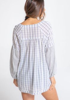 Perfectly relaxed and effortless, this cotton top is designed in a classic mixed plaid print. Featuring voluminous long sleeves, a subtle high/low hemline, and delicate shirring details. The raw unfinished hem adds a lived-in feel. FINAL SALE Mixed plaid print Relaxed, oversize fit Voluminous long sleeve Elastic wrist cuff High/low hemline Raw-edge hem Side vents V-neckline Shirred detail at the back Slightly sheer Cotton shirt Model is 5'9, wearing a size S.Style: I-13864W-RTM-MP Relaxed Fit Plaid Blouse For Daywear, Chic Plaid Blouse For Daywear, Plaid Blouse For Daywear In Fall, Fall Daywear Plaid Blouse, Long Sleeve Plaid Tops For Daywear, Gingham Blouse For Daywear, 70s Inspired Crochet, Oversized Plaid Shirts, Cotton Tunic Tops