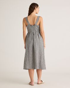 Step into warm weather with our 100% European Linen Fit & Flare Midi Dress. Featuring adjustable straps and a smocked back, this flowy, A-line silhouette will hug your curves in all the right places. And like all our linen, it’s soft, breathable, and lightweight, making it a go-to dress for spring or summer.  | Quince | Women's 100% European Linen Fit & Flare Midi Dress in Khaki / Black Gingham, Size XS Flare Midi Dress, Black Gingham, Dress For Spring, European Linens, Quince, Fit & Flare, Warm Weather, Smocking, Gingham