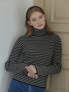 Editor's NotesThis is a striped turtleneck knit made from a warm cashmere-wool blend yarn. Its ribbed structure enhances both elasticity and warmth, making it suitable for a variety of looks.- Semi-cropped length that makes your look stylish- Slim fit that makes your body curves accentuated- A logo metal decoration at the hem to add a stylish point of interest* Imperfections in thread trimming, due to being done by hand, during the manufacturing process are not considered defects.Measurements(in Black Horizontal Stripe Winter Sweater, Winter Striped Sweater For Workwear, Striped Sweater For Winter Workwear, Winter Striped Sweater For Work, Winter Sweater With Horizontal Stripes, Striped Turtleneck Sweater For Layering, Striped Knit Turtleneck Top, Stretch Striped Ribbed Sweater, Classic Striped Knit Sweater