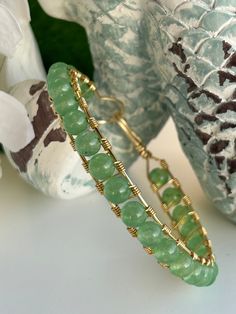 This boho bangle bracelet is inspired by the pure and natural beauty of the beach.  In fact, many of the products in my shop are handmade on the beach while savoring the cool breeze and calming ocean sounds. The bracelet is a channel set style and the gemstone is a 6 mm polished green aventurine reminiscent of the ocean.  Green aventurine is a gemstone of luck.  It tends to harmonize us to positive outcomes and opportunities, helping us expand our sense of what is possible.  Given green aventuri Boho Bangle Bracelets, Gemstone Bangle Bracelets, Boho Bangle, Ocean Green, Cat Bracelet, Gemstone Bangle, Hippie Bracelets, Cool Breeze, Ocean Sounds