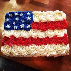 an american flag cake with red, white and blue frosting on it's side