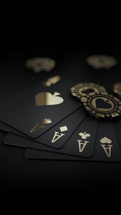 several cards with gold and black designs on them