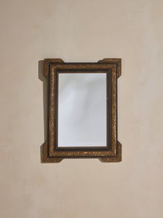 a mirror mounted to the side of a wall