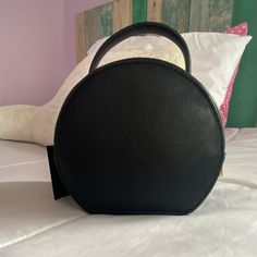 Nice Sleek Black Circle Bag With Gold Detailing. The Bag Is Leather. Perfect For Dinners Or Gatherings. A Lot Of Space Inside The Bag. Never Worn Black Bag With Detachable Handle For Night Out, Black Shoulder Bag With Detachable Handle For Night Out, Black Top Handle Bag For Night Out, Trendy Shoulder Bag With Detachable Handle For Night Out, Black Trendy Satchel With Round Handle, Chic Shoulder Bag With Zipper And Round Handle, Chic Shoulder Bag With Zipper Closure And Round Handle, Trendy Black Satchel With Round Handle, Chic Satchel Bag For Night Out