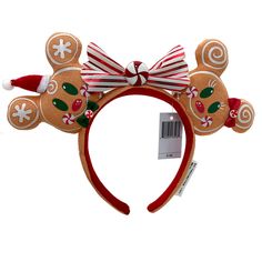 a christmas mouse ears headband with candy canes on it