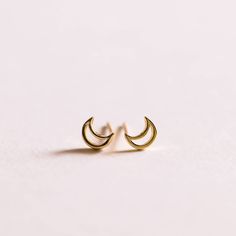 a pair of gold moon stud earrings by JaxKelly Boho Lounge, Moon Stud Earrings, Multiple Piercings, Intention Candles, Crescent Moon Earrings, Moon Studs, Gold Moon, Healing Jewelry, All The Way Up