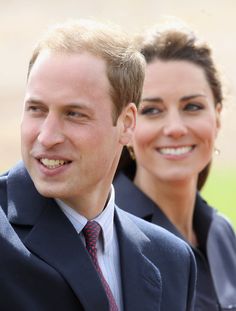 a man and woman are smiling for the camera