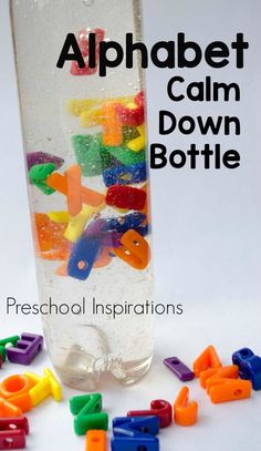 the alphabet calm down bottle is filled with colorful plastic letters and numbers to help kids learn how to use it