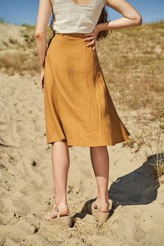 "We prefer our skirts sweeping in the air. Knee-length button front linen skirt. FABRIC: 100% softened Lithuanian linen COLOR: Please choose the desired color from the side menu. STYLE: Midi length linen skirt with buttons. SIZE CHART: 2 US/ 6 AU/ 34 EU: Bust 31.5\" (80 cm) , Waist 23\" (59 cm), Hips 35\" (88 cm) 4 US/ 8 AU/ 36 EU: Bust 33\" (84 cm) , Waist 25\" (63,5 cm), Hips 36\" (92 cm) 6 US/ 10 AU/ 38 EU: Bust 35\" (88 cm) , Waist 26,5\" (67,5 cm), Hips 38\" (96 cm) 8 US/ 12 AU/ 40 EU: Bust Linen A-line Pleated Skirt, Beach Linen Flared Skirt, Linen Midi Skirt With Lining, A-line Linen Pleated Skirt, Summer Knee-length Linen Skirt, Lined Linen Flared Skirt, Linen Flared Skirt With Lining, Linen Flared Skirt With Lined Detail, Flared Linen Skirt With Lining