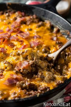 a skillet filled with meat and cheese