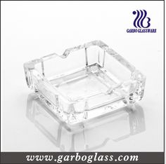 an empty glass ashtray is shown on a white background with the words garbogglass com