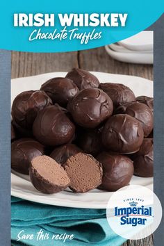 chocolate truffles on a white plate with a blue napkin next to it and the title irish whiskey chocolate truffles give this recipe