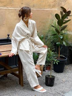 "Milk kimono linen suit is stylish and comfortable. This boho oversized pajama-style suit consists of a two-piece jacket under the belt and trousers. The suit will be suitable for various occasions, both everyday for every day and for special occasions. DETAILS - milk color - linen fabric - loose fit - under the belt SIZES This dress is available in 2 sizes S-M and L-XL S-M bust 38.6\"/ 98 cm waist 28\"/ 72 cm hips 38.6\"/ 98 cm L-XL bust 43\"/ 110 cm waist 34.65\"/ 88 cm hips 45\"/ 115 cm More Kimono Suit Woman, Beige Sets For Spring Daywear, White Spring Sets With Kimono Sleeves, White Sets With Kimono Sleeves For Spring, Casual Linen Kimono For Loungewear, Beige Linen Kimono For Loungewear, Chic White Linen Sets, Casual Beige Kimono For Loungewear, Linen Sets For Spring Daywear