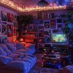 a living room filled with lots of furniture and pictures on the wall next to a flat screen tv