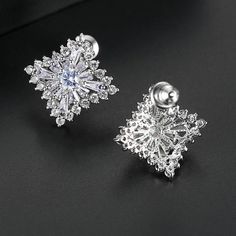 Material: Copper, Rhodium Plated, Cubic ZirconiaSize: 1.7cm by 1.7cmWeight: 3.6g per pairDesign: Crystal Square Diamond Shaped Stud Earrings Color: White, Silver Formal Flower Earrings With Cubic Zirconia, Formal Flower Earrings With Sparkling Cubic Zirconia, Formal Flower Earrings With Sparkling Stones, Formal Cubic Zirconia Flower Drop Earrings, White Cubic Zirconia Pierced Diamond Earrings, Diamond White Pierced Party Earrings, Silver Cubic Zirconia Round Plug Earrings, Silver Drop Earrings With Sparkling Stones, Silver Cubic Zirconia Flower Earrings As Gift