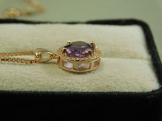 We offer free sizing, free shipping in the USA only, and a free appraisal upon request. If you are an international buyer, please contact us to work out shipping price. Also, we do not pay customs fees. Thanks. February and November Birthstone Sku: YS60 This is a 3.48 ct. Oval Amethyst pendant. This is a natural Amethyst in a Rose Gold over sterling silver setting. The setting also has 28 White Topaz accent stones. The beautiful Amethyst is 9 mm x 11 mm The total carat weight is 3.76 carats. The Luxury Oval Amethyst Jewelry, Luxury Purple Round Jewelry, Luxury Purple Jewelry, Elegant Oval Amethyst Pendant Jewelry, Oval Amethyst Jewelry With Brilliant Cut, Rose Gold Plate, Topaz Pendant, November Birthstone, February Birthstone