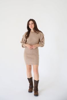 A ribbed knit mini dress with the following features: Round neckline. Bishop sleeves with ruffle detailing. Loose fit. Model Info: Height: 5 ft 8 in wearing Size S. Chic Ribbed Knee-length Mini Dress, Chic Knee-length Ribbed Mini Dress, Fall Mini Dress With Ruffles, Fall Ribbed Mini Bodycon Dress, Ribbed Knit Mini Dress, Fall Bodycon Knit Mini Dress, Stretch Mini Dress With Ruffles For Winter, Ribbed Mini Bodycon Dress For Fall, Fall Ruffled Bodycon Dress