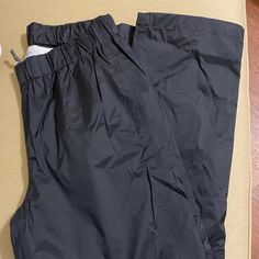 Columbia Black Windpants. No Tag But Never Worn. Adult Small. Drawstring And Elastic Waist. Waterproof Full Length Black Bottoms, Black Stretch Waterproof Bottoms, Black Outdoor Pants With Elastic Waistband, Black Stretch Bottoms For Outdoor, Black Full Length Bottoms For Outdoor, Black Moisture-wicking Sporty Pants, Black Moisture-wicking Cargo Pants For Outdoor, Columbia Pants, Columbia