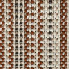 a close up view of an area rug with brown and white squares