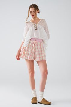 Step into casual chic with these Pink Checkered Print Shorts, designed for comfort and style. Made from 100% cotton, these shorts are perfect for any casual outing, offering a breathable and soft feel that ensures all-day comfort.  Featuring a high waist, these shorts provide a flattering silhouette by cinching at the waist, enhancing your natural curves. The tight-fitting waist detail ensures a snug and secure fit, while the elastic waistband adds an element of stretch for added comfort. The relaxed fit and straight cut offer a laid-back yet stylish look, making these shorts a versatile addition to your summer wardrobe.  The playful pink checkered print adds a fun and vibrant touch, perfect for pairing with a simple top or tank for a casual, yet put-together outfit. With a regular fit, th Casual Spring Pajama Shorts, Spring Casual Cotton Pajama Shorts, Casual Cotton Pajama Shorts For Spring, Comfortable Relaxed Fit Shorts For Spring, Comfortable Spring Vacation Shorts, Chic Cotton Shorts With Elastic Waistband, Stretch Cotton Vacation Shorts, Stretch Cotton Shorts For Vacation, Stretch Cotton Shorts For Day Out