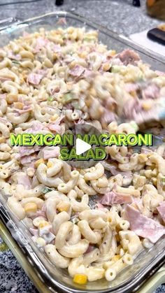 mexican macaroni salad with ham and cheese in a glass casserole dish