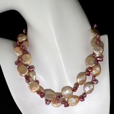 This is part of Chairish’s Fine Jewelry assortment.  Pearls are always appropriate' Jackie Kennedy  Elegant Handmade Peach and Mauve Pearl Necklace – 27 Inches of Timeless Beauty  This one-of-a-kind, handmade necklace features a stunning combination of 13-14mm peachy-toned and mauve briolette pearls. The elegant design highlights iridescent peach-tone Coin Pearls, delicately accented by smaller mauve pearls for a refined and sophisticated look. At a versatile 27 inches, this necklace is the perf Beaded Briolette Pearl Necklace, Handmade Pearl Necklace With Briolette Shape, Elegant Pink Pearl Necklace With Natural Stones, Elegant Pink Pearl Necklace With Gemstone Beads, Elegant Pink Pear-shaped Necklace, Gift From The Sea, Coin Pearls, Hammered Gold, June Birthstone