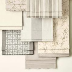 several different types of towels hanging on a wall