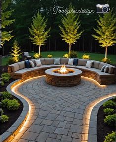 an outdoor fire pit surrounded by landscaping lights