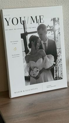 a wedding photo is displayed on a shelf