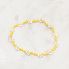 Handmade seed bead bracelet or anklet (see sizing)  Each flower bracelet stretches up to roughly 2.5cm easily while wearing. All sizes are approximate Use code SAVE2 for $2 off your purchase (minimal 2 bracelets in order) Find us on instagram & tag us for a chance to win a free sticker! https://www.instagram.com/daintydaisybeadco/ Anklets Beaded Ideas, Summer Yellow Beaded Bracelets With Tiny Beads, Casual Yellow Bracelets With Tiny Beads, Yellow Beaded Bracelets For Beach, Summer Flower Bracelet With Tiny Beads, Yellow Seed Bead Bracelet, 90s Trends, Instagram Tags, Summer Bracelets