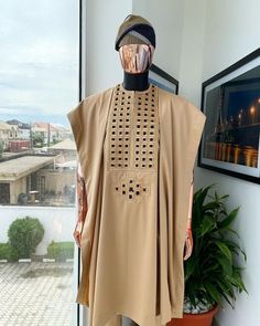 Step into a world of luxury and sophistication with our premium quality 100% cotton Agbada for men. Impeccably designed and tailored, this traditional suit comes in cream and black, adorned with intricate embroidery that showcases the beauty of Yoruba culture. Men Groom Suit, Agbada Design, Square Embroidery, Native Wears, Nigerian Men Fashion, Traditional Suit, African Wear Styles For Men, Pieces Men, Naija Fashion