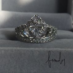 a diamond ring is sitting on top of a box