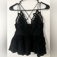 Free People Top | Color: Black | Size: Xs Flowy, Tiered Design To Complement The Intricate Crochet Lace Top. Crisscross Straps A-Line Silhouette Lined Bust Fitted Crochet Top For Spring Night Out, Black Sleeveless Lace Top For Spring, Black Crochet Top For Spring Party, Casual Black Lace Top, Chic Black Crochet Top For Night Out, Casual Lace Top For Night Out, Black Sleeveless Crochet Top For Party, Black Sleeveless Lace Top For Summer, Black Chic Crochet Top For Night Out