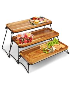 three wooden trays with food on them