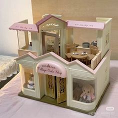 there is a doll house with furniture inside