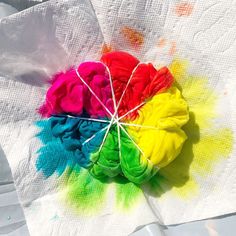 a multicolored cloth on top of a white table