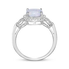 A bold lab-created opal cabochon gives this chic ring a mesmerizing look. Crafted in sterling silver The oval-cut lab-created opal centerpiece is haloed by white lab-created sapphires Loops of white lab-created sapphires decorate the slender shank for added sparkle Elegant Oval Opal Ring With Polished Finish, Elegant Silver Opal Ring With Accent Stones, Oval Halo Moonstone Ring Fine Jewelry, Oval Moonstone Halo Ring Fine Jewelry, Oval Opal Rings With Polished Finish, Elegant Opal Ring With Polished Finish, Fine Jewelry Oval Opal Ring With Polished Finish, Oval Opal Ring With Polished Finish In Fine Jewelry, Elegant Opal Rings With Polished Finish