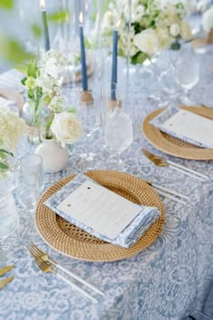 the table is set with place settings for dinner