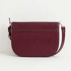 A thoughtfully designed, spacious messenger bag crafted from certified vegan leather in a rich burgundy. This bag strikes the perfect balance between style and utility, making it a versatile choice for both work and casual use. It features an adjustable cross-body strap, a convenient zipped inner pocket, and a secure magnetic fastening to ensure your essentials are well-protected. We also have the same bag in tan, and a smaller saddle bag in the same colourways Key features: Approx. 29 (L) x 21 Burgundy Leather Crossbody Flap Bag, Burgundy Crossbody Flap Bag With Adjustable Strap, Business Shoulder Bag With Detachable Strap In Burgundy, Burgundy Flap Shoulder Bag With Detachable Strap, Burgundy Shoulder Flap Bag With Detachable Strap, Burgundy Business Shoulder Bag With Detachable Strap, Burgundy Satchel With Adjustable Strap For Daily Use, Burgundy Crossbody Satchel For Everyday Use, Classic Burgundy Shoulder Bag With Removable Pouch