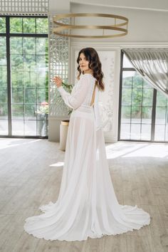 Step into your special day with the grace of a princess 👑, even before you put on your wedding gown. Our exquisite collection of bridal boudoir robes and nightgowns is designed to make every bride feel cherished and one-of-a-kind 💖. From joyful moments with your bridal party to quiet, reflective minutes before the mirror, our luxurious pieces add a touch of elegance and comfort to these precious moments. ✨ Elegance and Comfort Each robe and nightgown is crafted from the finest fabrics, includi Long Sheer Wedding Dress, Sheer Long Wedding Dress, Chiffon Wedding Dress With Sheer Back, Delicate Sheer Dress For Wedding Night, Fitted Sheer Robe For Wedding, Ethereal Wedding Gown With Sheer Bodice, Delicate Sheer Wedding Dress, Floor-length Lace Bodice Wedding Dress For Wedding Night, Elegant Floor-length Wedding Robe