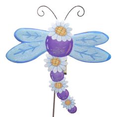 Blue And Purple Dragonfly Accented With Daisies Garden Stake. Brighten Up Your Garden With Our Newest Daisy Collection. A Mix Of Beautiful Daisy Stems And Playful, Whimsy Creatures, This Line Is Bound To Bring Some Happy To Your Home.. 29 In H X 14.5 In W X 0.5 In D. Purchase includes One Garden Stake. Purple Dragonfly, Round Top Collection, Decorative Garden Stakes, Garden Spring, Round Top, Garden Stakes, Garden Patio, Top Collection, Patio Garden